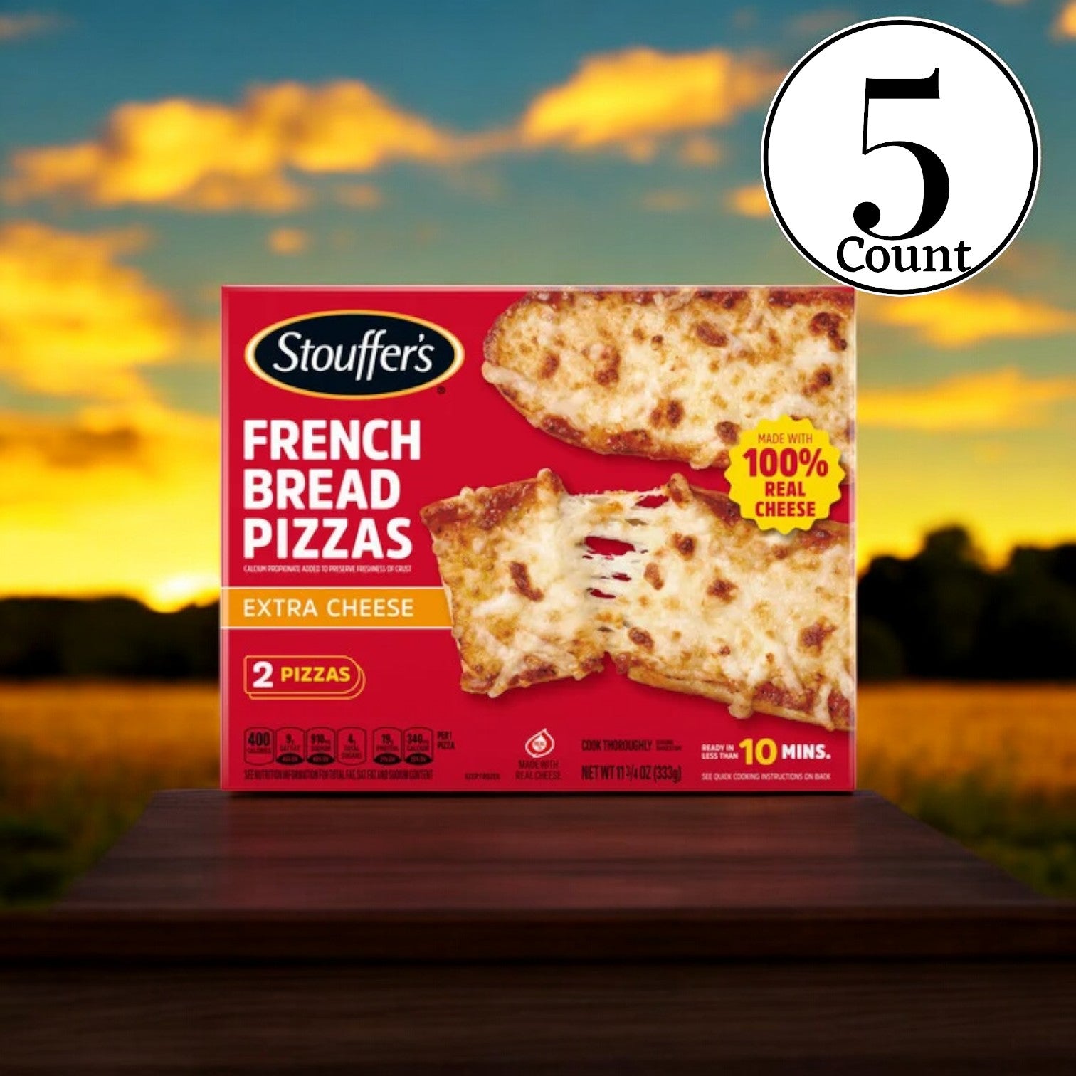 A set of Stouffer's Frozen Pizzas - Extra Cheese French Bread Pizza, consisting of 5 boxes in total, rests on a wooden surface with a sunset backdrop, ideal for cheese lovers craving a crispy crust experience.