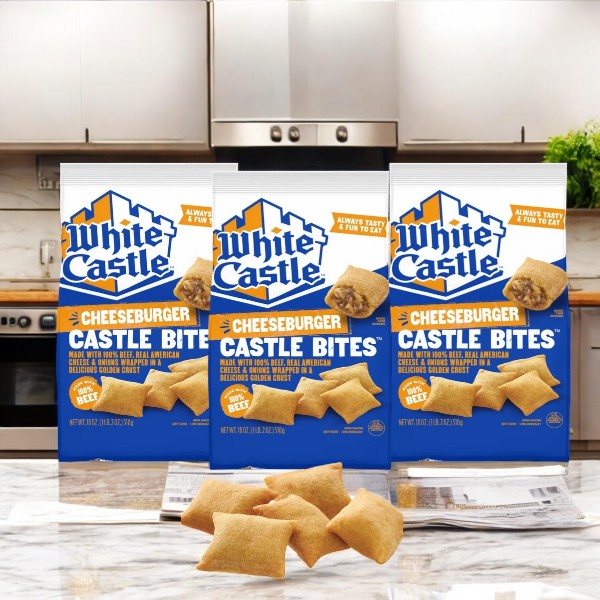 On the kitchen counter are three boxes of White Castle Cheeseburger Classic Bites, elegantly displayed with individual bites in front, capturing the essence of their signature steamed cooking.