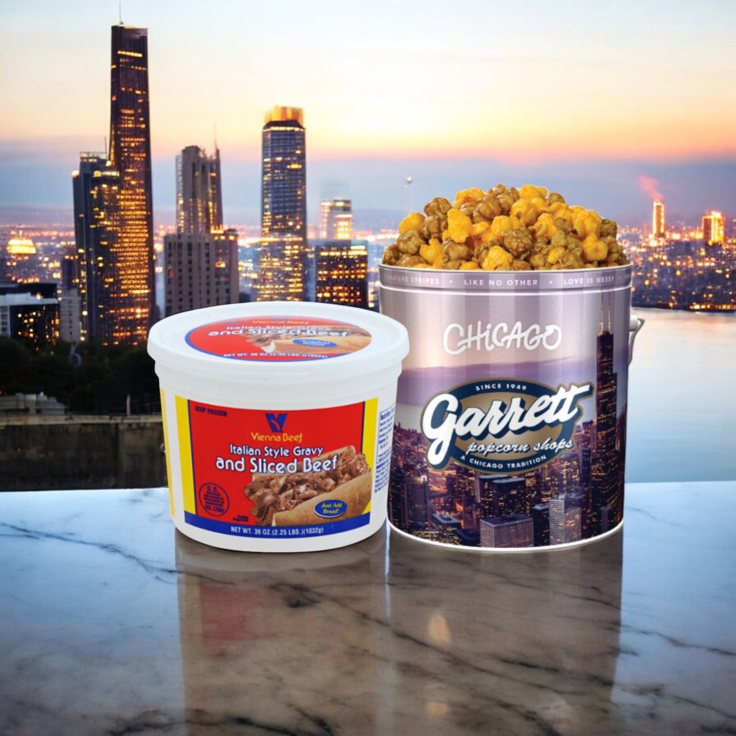 Easy Lunches' Vienna Beef Italian Gravy & Sliced Beef and Garrett Popcorn Tin celebrate Chicago's culinary heritage, set against a marble surface with the city skyline in the background—plus, enjoy free shipping!.