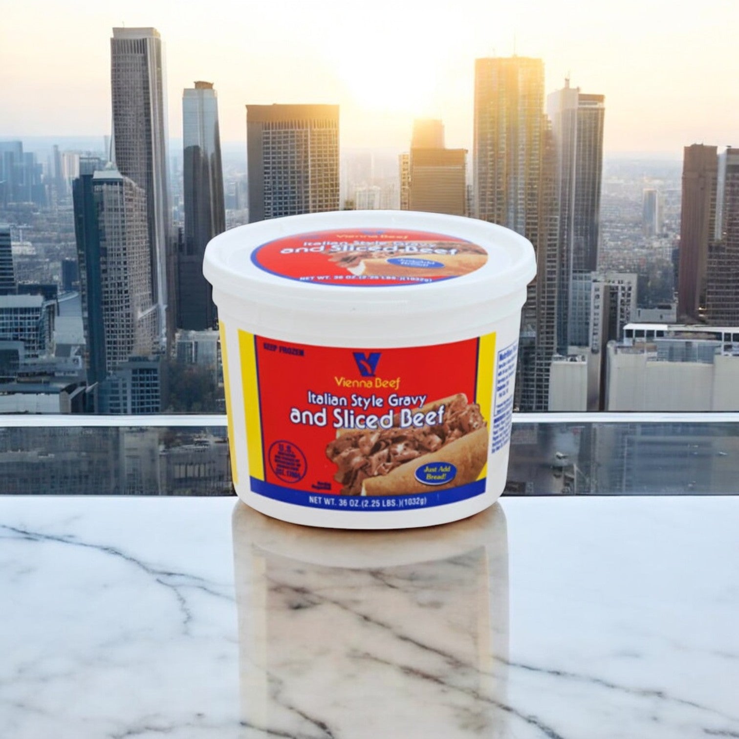 A Vienna Beef Italian Gravy & Sliced Beef container from Easy Lunches rests on marble, with a city skyline and sunrise evoking Chicago's culinary legacy, capturing the essence of an iconic Italian Beef Sandwich.