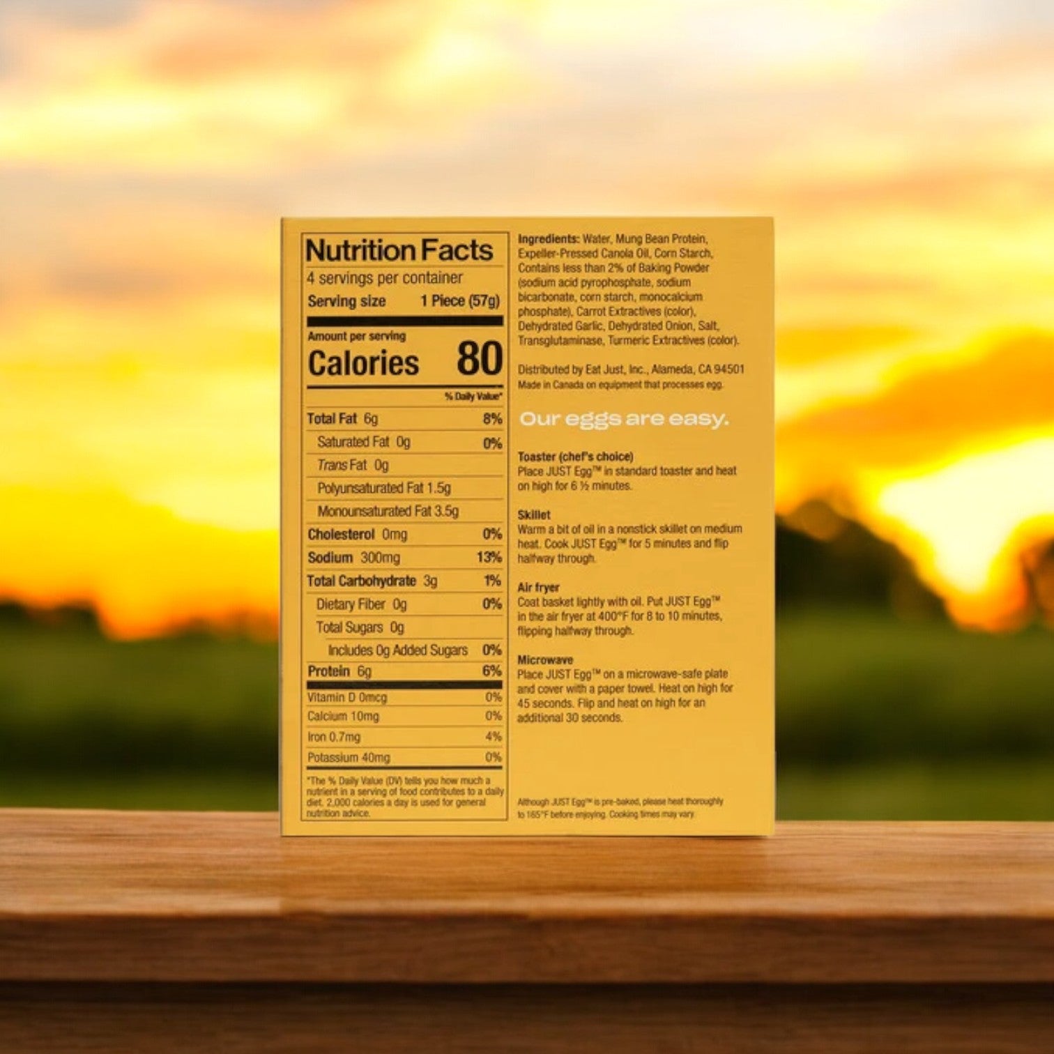 A package of Just Egg's 8 oz. plant-based egg alternative, JUST Egg Folded, is displayed against a sunset background.