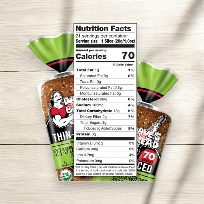 An image of a bread package with a label showing nutrition facts. The bread is thin-sliced and has 70 calories per slice. The package is labeled "Dave's Killer Bread 21 Whole Grains & Seeds Thin-Sliced, Whole Grain Organic Bread, 20.5 oz Loaf.