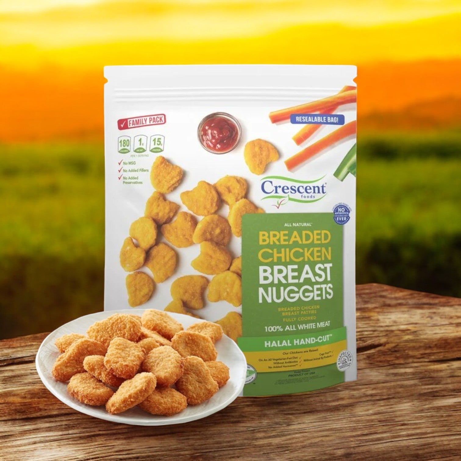 A 3 lbs package of Crescent Foods Halal All Natural Chicken Breast Nuggets rests next to a plate of premium chicken breast nuggets, with a blurred outdoor background.