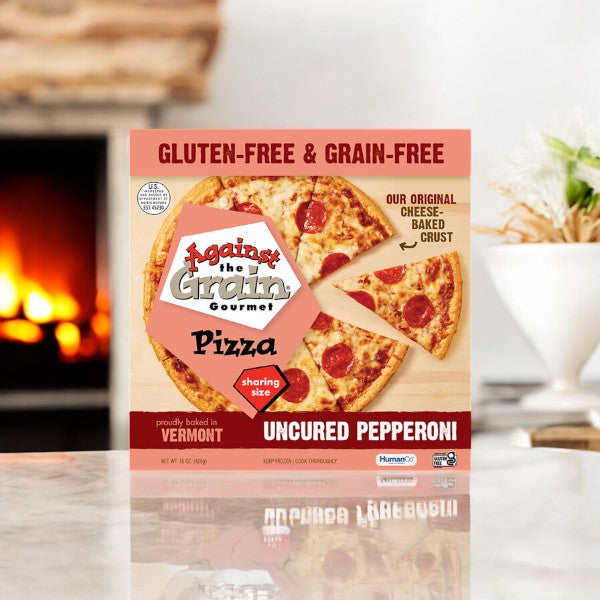 A Sharing Size box of Easy Lunches' Against The Grain Gluten & Grain Free Uncured Pepperoni Pizza, weighing 15 oz., sits invitingly on a countertop.