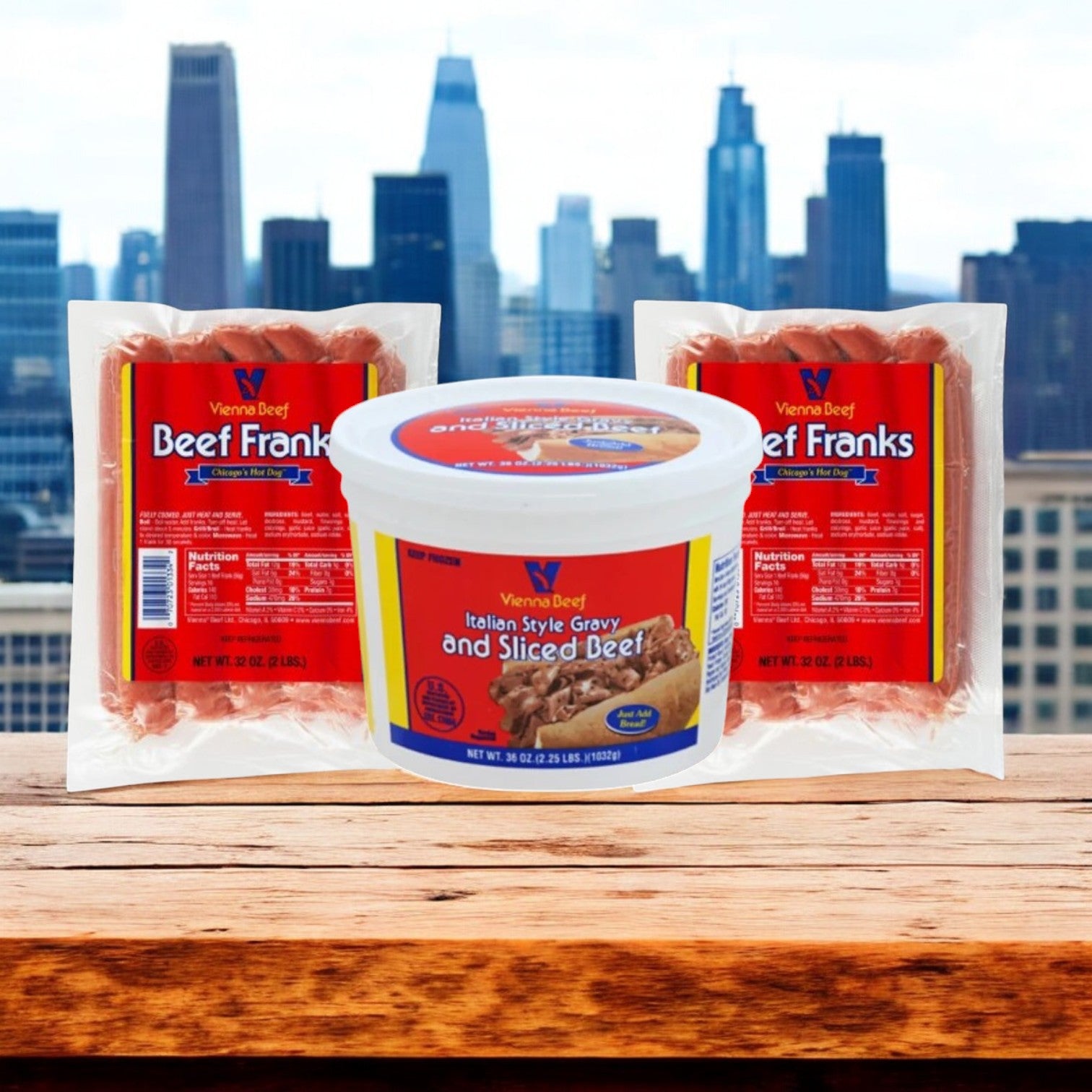 An Easy Lunches Chicago Classics Combo features Vienna Beef Hot Dogs and Italian-Style Beef with Gravy on a wooden surface, set against a city skyline.