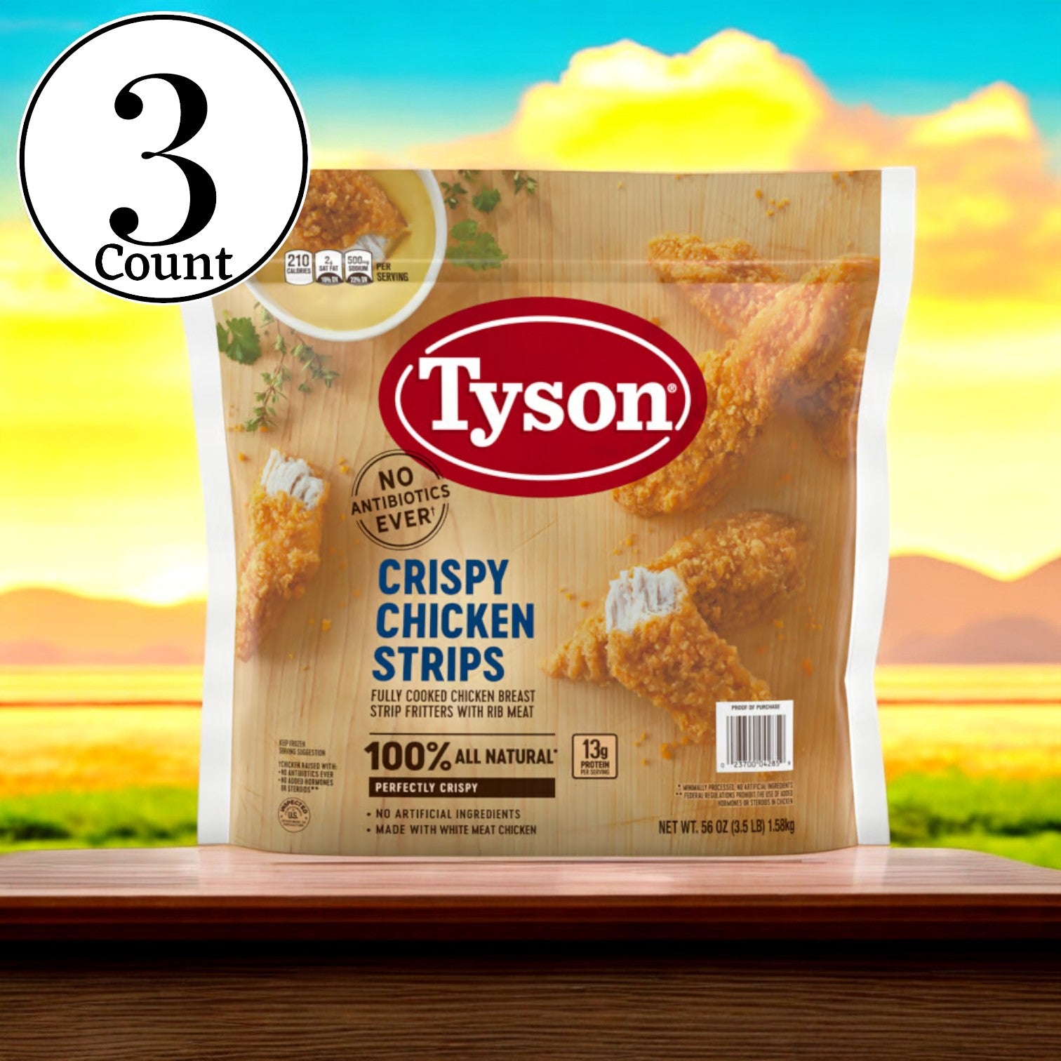 A package of Tyson Fully Cooked Crispy Chicken Strips, ideal for a fast meal, is set on a wooden table against a picturesque backdrop. The packaging prominently features "3 Bag," "No Antibiotics Ever," and emphasizes the convenience of having fully cooked crispy chicken strips.