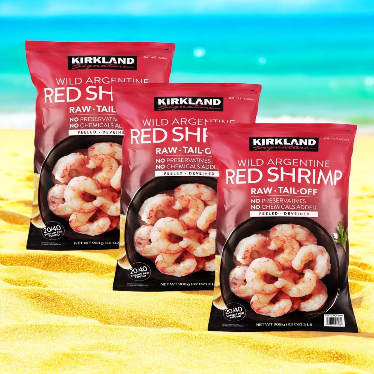 Three bags of Easy Lunches Kirkland Signature Argentine Red Shrimp (20/40 per lb, 2 lbs each, 6 lbs total) stand upright on sand with a beach and ocean in the background, highlighting these premium wild-caught shrimp.