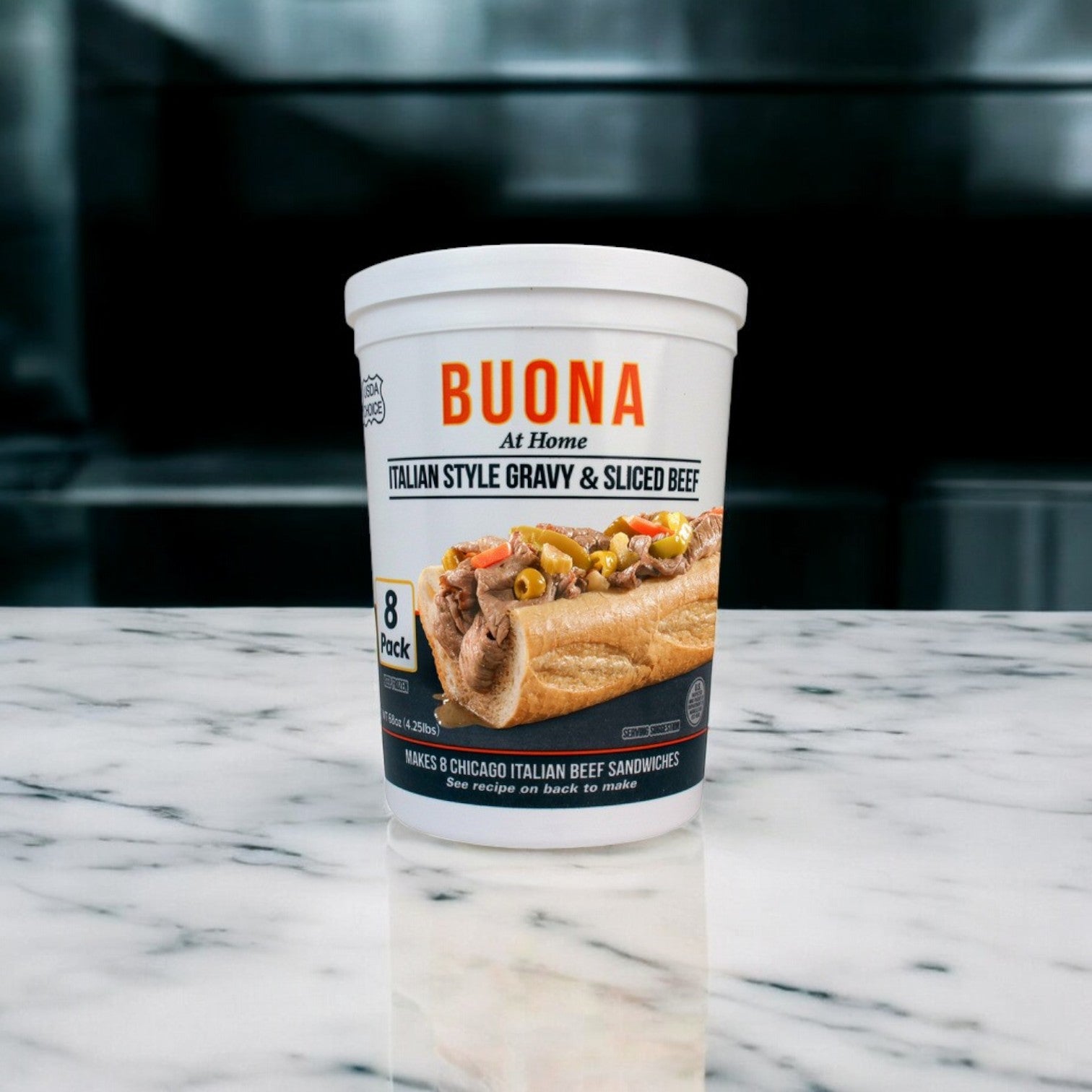 On a marble surface sits a container labeled "Buona Beef 8 Pack Kit!" by Easy Lunches, capturing the essence of Chicago-style Italian beef.