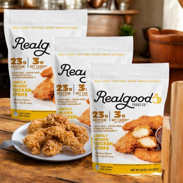 Three bags of Realgood Foods Co. 20 oz gluten-free chicken breast strips are displayed with a plate of cooked, high-quality strips in front.