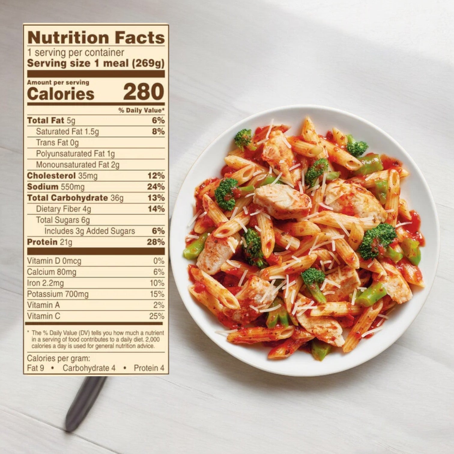 A serving of Grilled Chicken Marinara with Parmesan from the Easy Lunches College Ultimate Meal Pack sits next to a detailed nutrition facts label showing 280 calories per serving, making it one of the nutritious meal options perfect for dorm room meals.