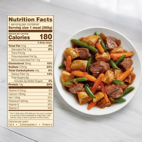 A bowl of beef stew with potatoes, carrots, and green beans next to a detailed nutrition facts label indicating a serving size of 269g and 180 calories – the perfect nutritious meal option for Easy Lunches College Ultimate Meal Pack users seeking convenient dorm room meals.