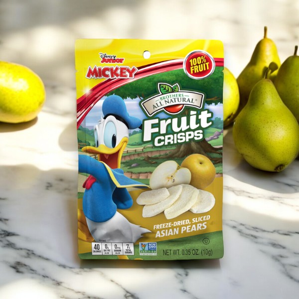 A package of Brothers All Natural Disney Freeze-Dried Asian Pear Fruit Crisps (.35 oz - 1 Count) by Brothers, featuring Mickey Mouse and containing freeze-dried, sliced Asian pears. It is placed on a marble surface with whole pears in the background, making it a delightful and healthy snack for children.