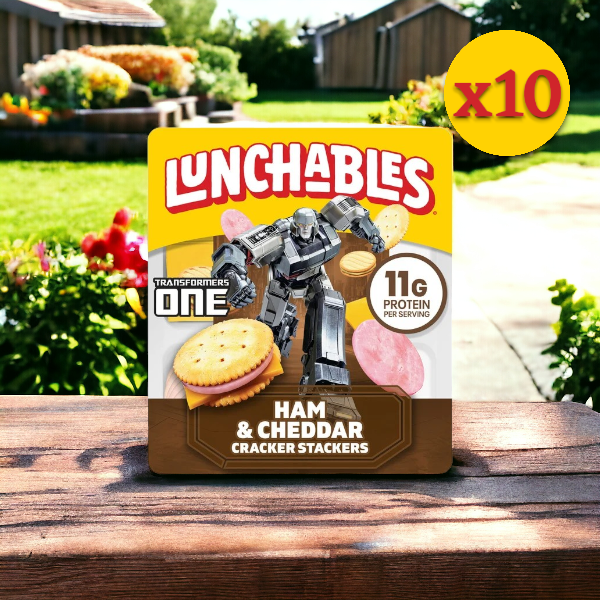 A package of Lunchables Ham & Cheddar Cheese (3.5 oz.) from the 10 Pack collection features a Transformers ONE design, making it a convenient meal. This ready-to-eat snack provides 11g of protein per serving and is shown outdoors with flowers in the background.