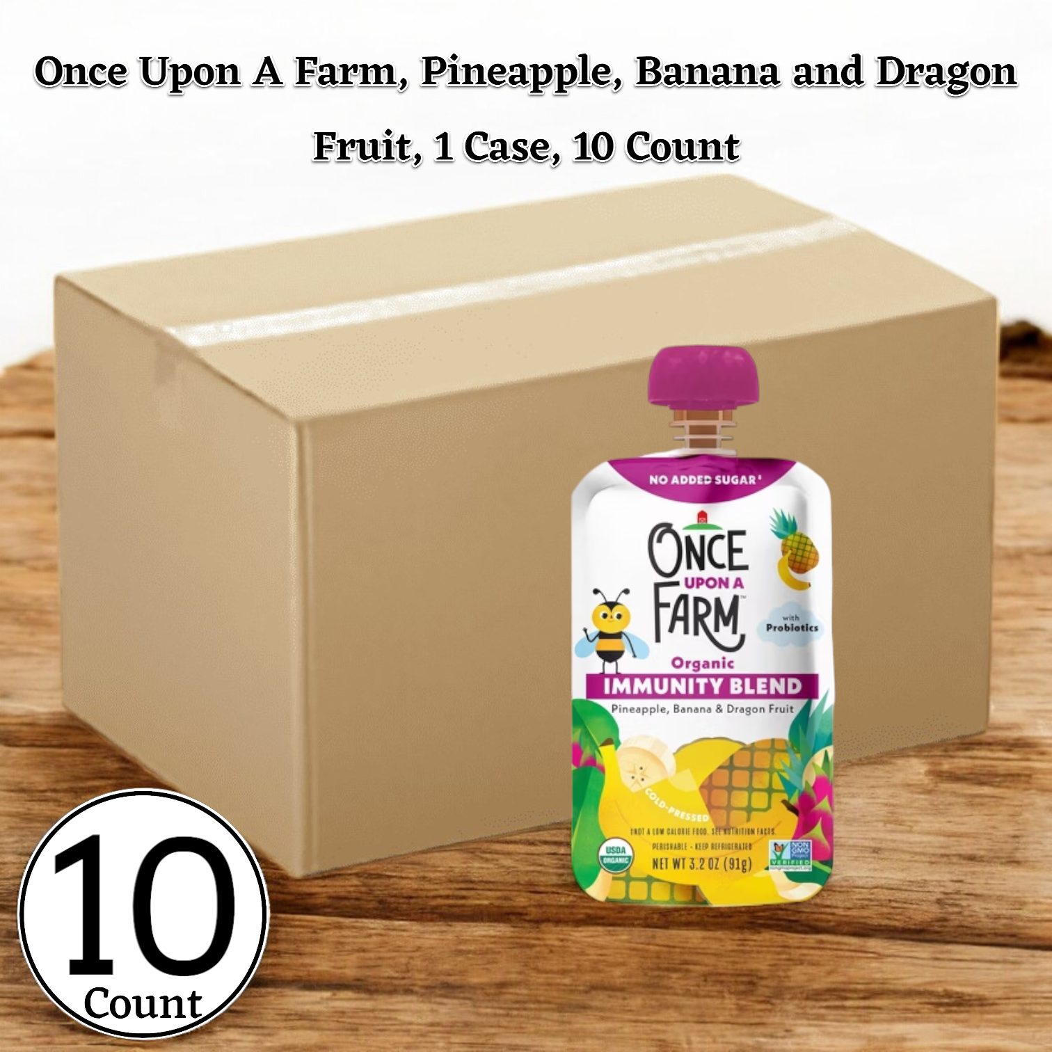 A carton of Once Upon a Farm Pineapple, Banana, and Dragon Fruit juice on a wood surface, offering wholesome nutrition with its Organic Fruit & Veggie Blend.