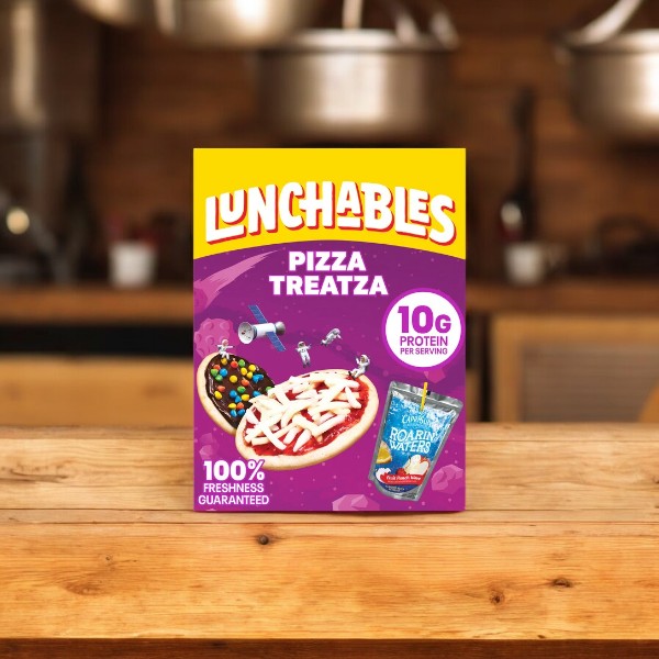 A box of Lunchables Pizza Treatza placed on a wooden counter, showcasing its colorful design and advertising 10g of protein per serving, also includes a Capri Sun Berry Drink pouch on the packaging. This convenient meal is one of the selections from the Lunchables Variety Bundle, which features an assortment including 10 Nachos With Cheese Dip, 10 Pizza Treatza, 10 Extra Cheesy Pizza, and 10 Chicken Nugget Kabobbles - totaling 40 Lunchables!