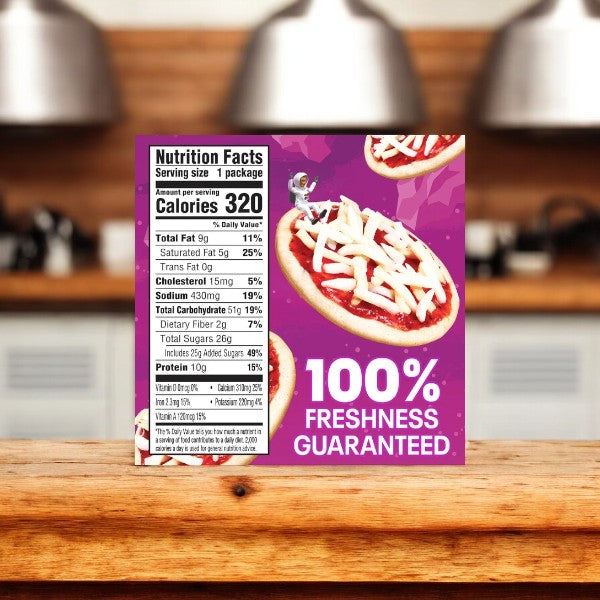 A package of Lunchables Pizza Treatza, 10.5 oz., placed on a wooden counter in a kitchen, displaying nutrition facts and "100% Freshness Guaranteed" text on the front, alongside another Lunchables Snack Pack.