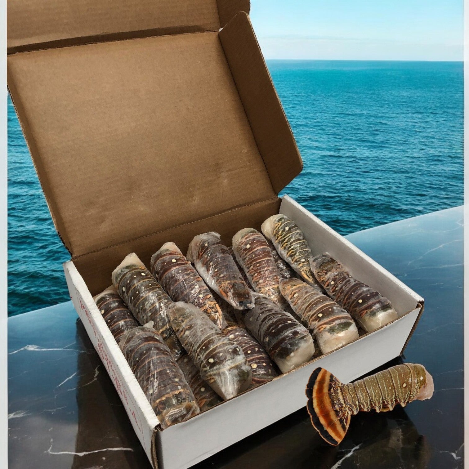 A 10-pound box of Easy Lunches' Lobster Tail Warm Water from Nicaragua rests on a marble surface, with the tranquil ocean view in the background, highlighting the charm of these sustainably sourced delights.