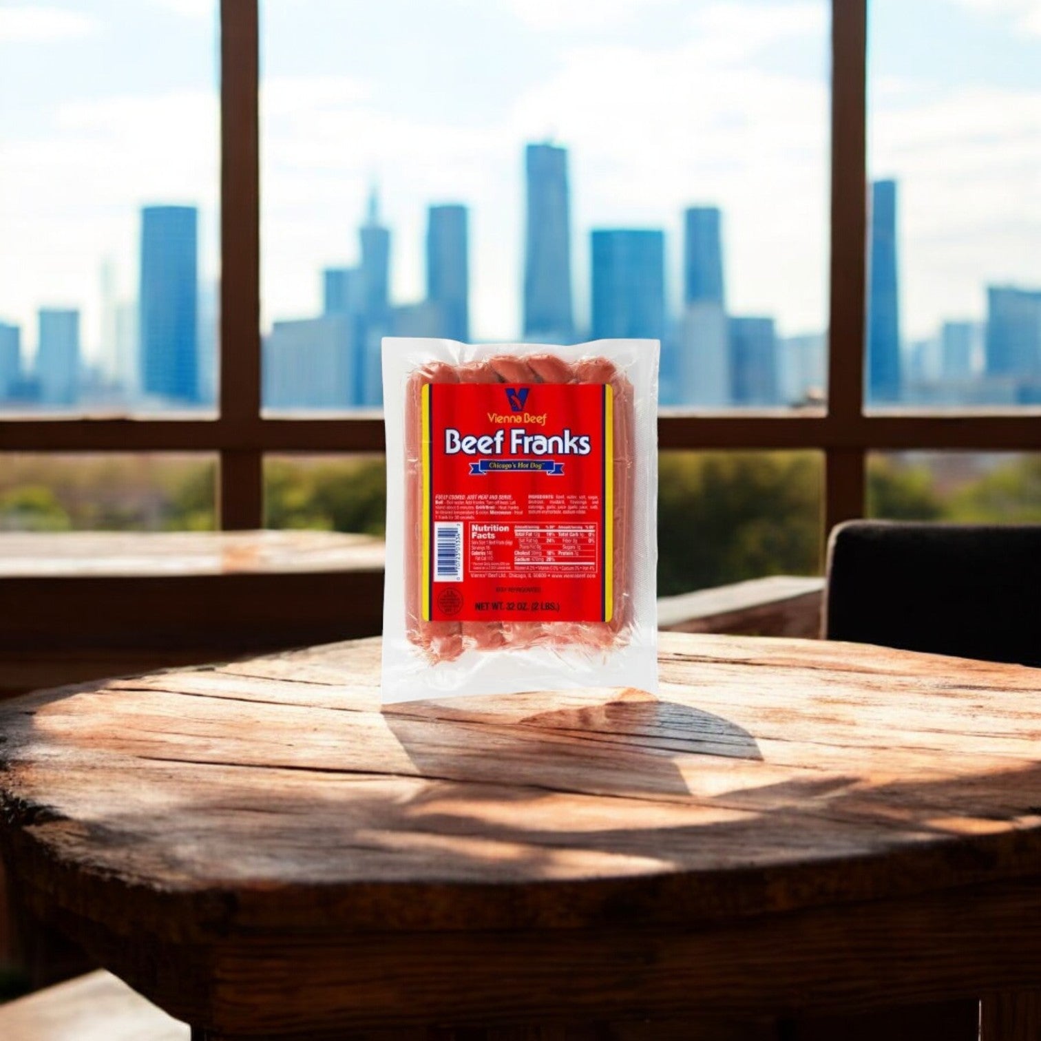 A package from Easy Lunches' Chicago Classic Meat Combo, featuring Vienna Beef Maxwell St. Polish Sausage, Fully Cooked Franks & Italian Beef, sits on a wooden table with the iconic Chicago skyline in the background.