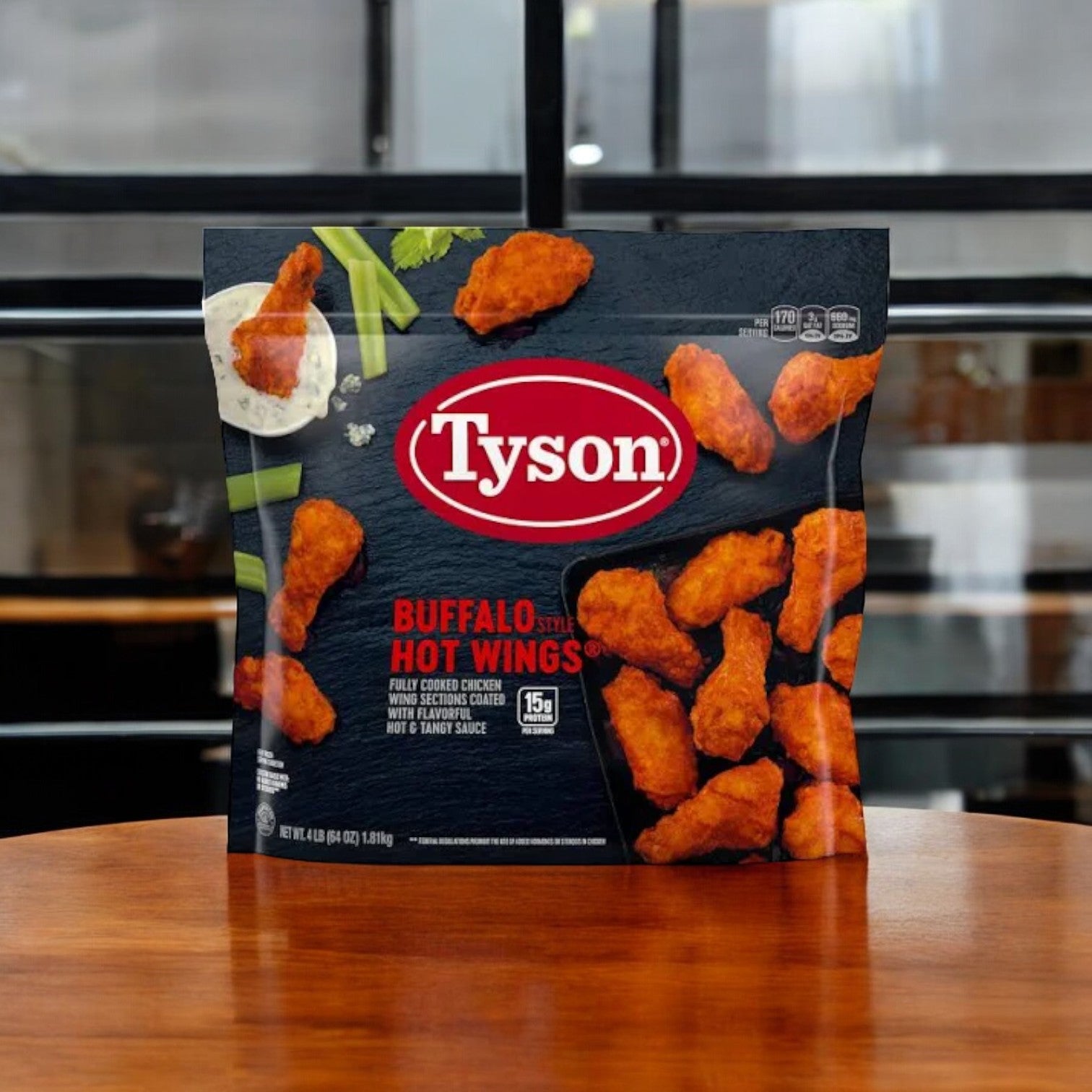 A package of Tyson Buffalo Hot Wings on a wooden surface, with the product image showcasing chicken wings, celery, and dipping sauce on the packaging—an ideal component for your easylunches Game Day Bundle!! which includes Red Barons 24 Pizzas, 1 Lifehouse Homestyle Ranch, 2 Bags of Tyson Buffalo Hot Wings, and 1 Celery Sticks! A total of 6 items!