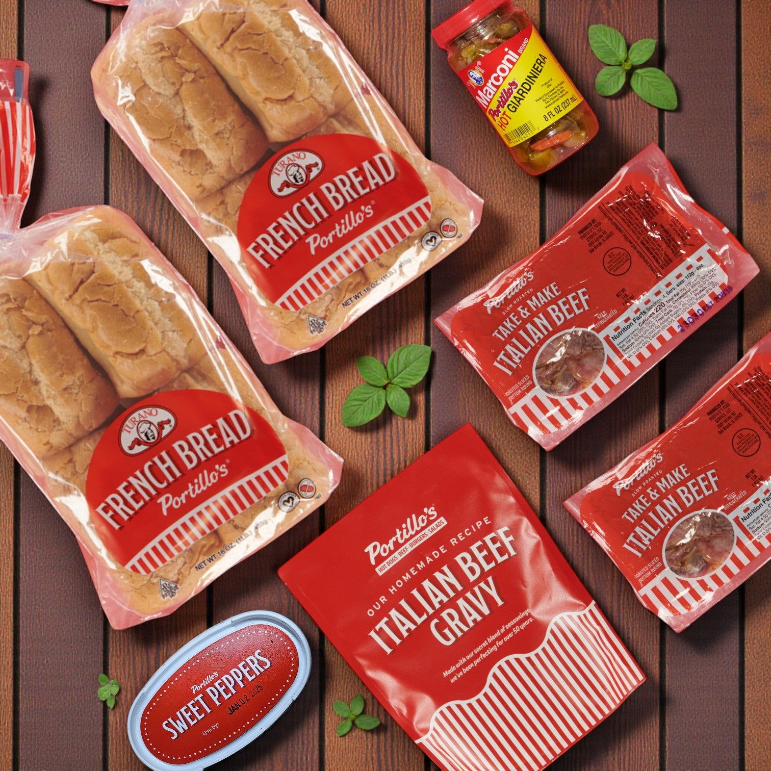 Portillo's 16 Italian Beef Combo & Vienna 16 Pack Hot Dog Kit by Easy Lunches is arranged on a wooden surface, featuring Italian beef, French bread, beef gravy, sweet peppers, and giardiniera—perfect for parties!.