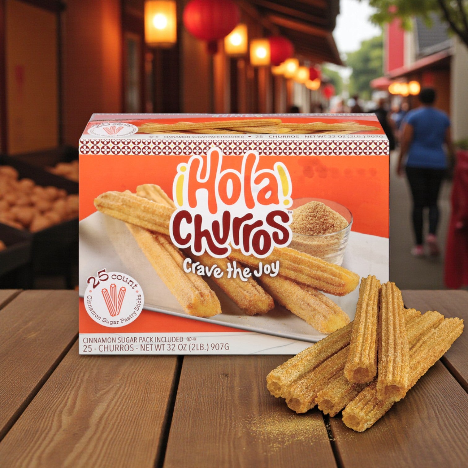 A box of Easy Lunches Hola Churros! Pastry Sticks, Cinnamon Sugar – 25 Count is displayed outdoors, showing ready-to-cook churro sticks and a bowl of cinnamon sugar in front.