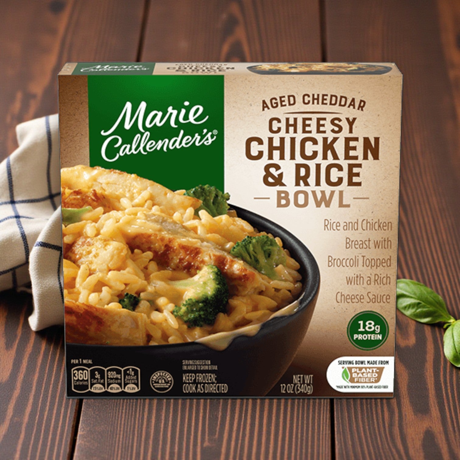 Marie Callender's Comfort Classics Entrée Combo – 5 Delicious Meals, shown on a wooden table, features rice, chicken, broccoli, and cheese sauce—classic comfort from Marie Callender’s.