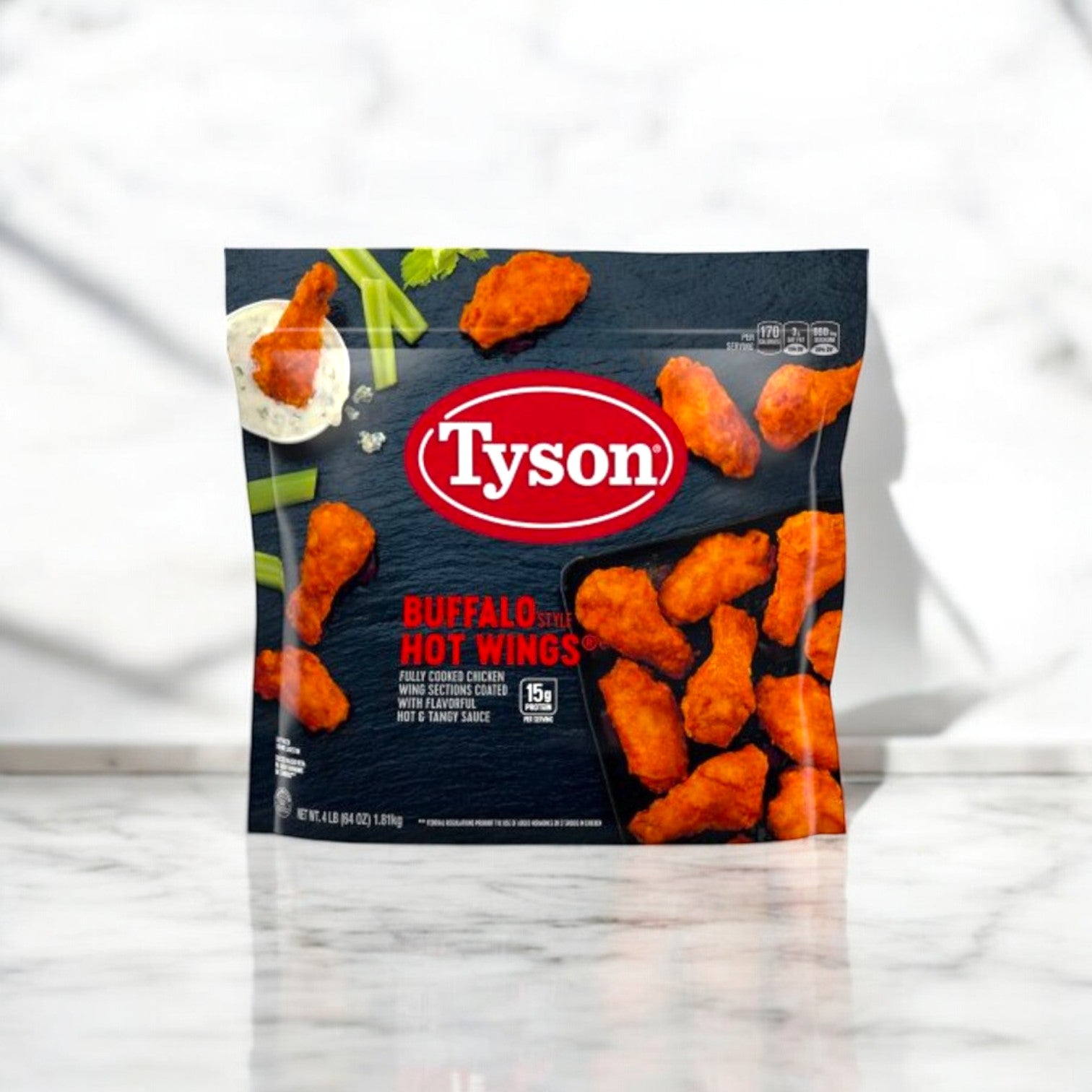 A 4-pound bag of Tyson Buffalo Style Hot Wings on a marble surface, highlighting fully cooked chicken wings flavored with cayenne pepper sauce—a perfect spicy snack.