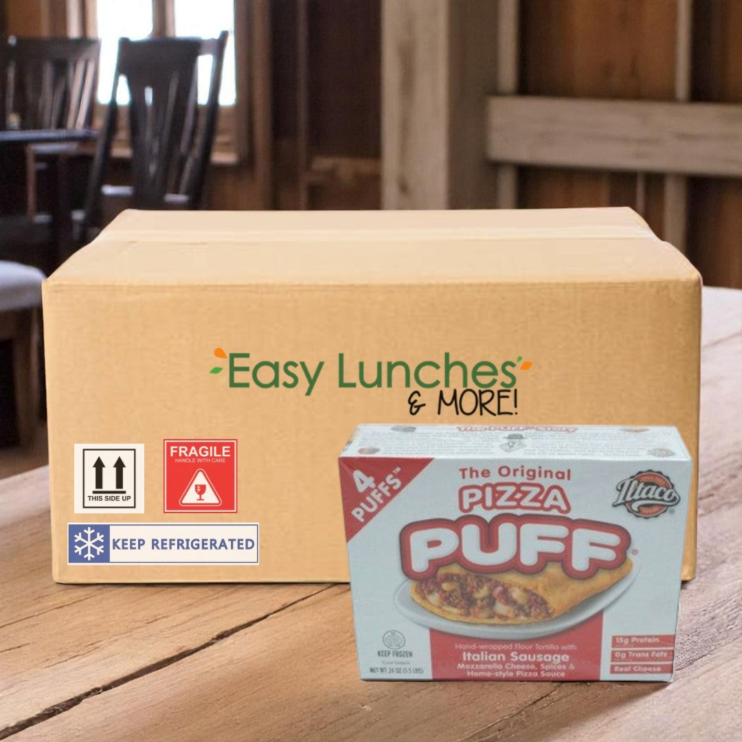 A cardboard box labeled "Easy Lunches & MORE!" sits on a wooden table next to a box of The Original Pizza Puffs The Original Puff Pizza—2 Count, 24 Oz—a classic Chicago snack made with Italian sausage.