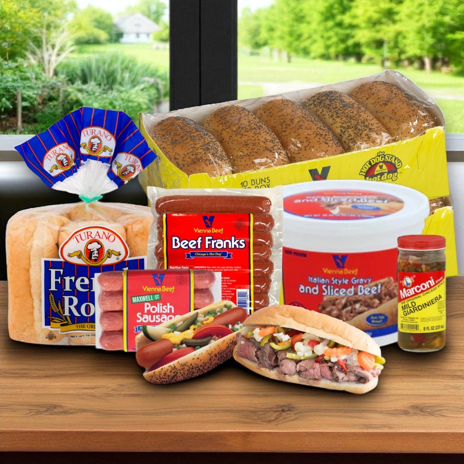 The Chicago Classic Meat Combo – The Ultimate Windy City Feast! by Vienna Beef is displayed on a table with a window view, featuring packaged bread, beef franks, Polish sausage, sliced Italian beef with gravy, and giardiniera.