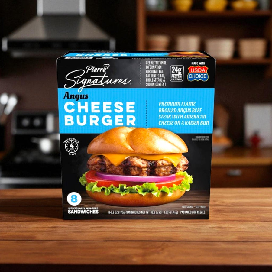 A box of Tyson Pierre Signatures Angus Cheeseburger, 6.2 oz, 8 ct, rests on a kitchen counter, showing a flame-broiled burger with cheese and beef. Each cheeseburger is individually wrapped for convenience.